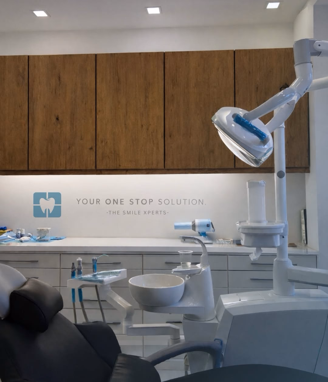 The Smile Xperts treatment room with dental chair and cabinetry